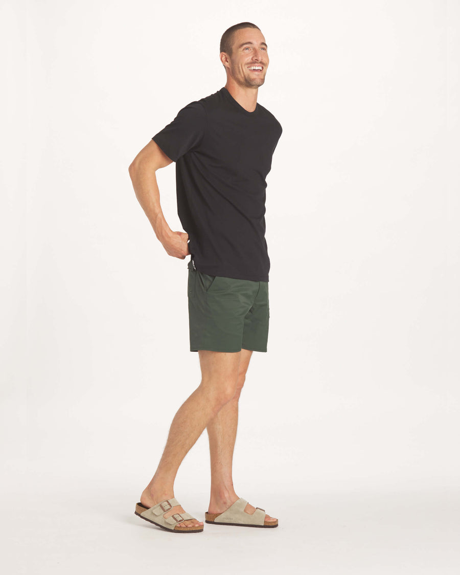 Man smiling wearing the Luna Men's Tee
